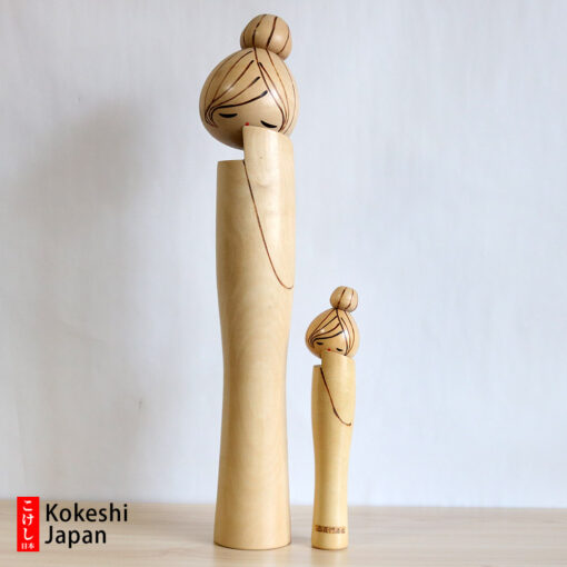 pair of vintage creative kokeshi by kenichi murakami