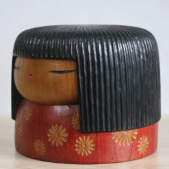 big vintage kokeshi doll by yamanaka sanpei left