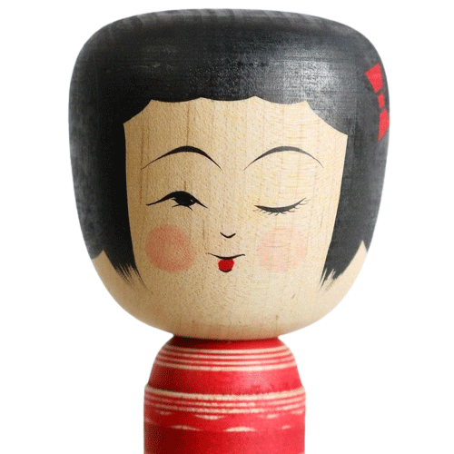 traditional kokeshi doll winking