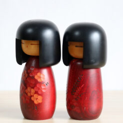 Red Kokeshi Doll Set By Fujikawa Masae Left