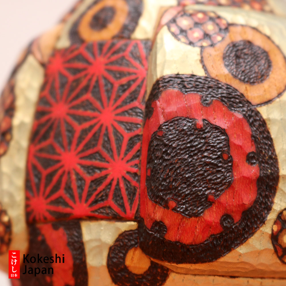 Burnt Wood Decorations On A Kokeshi Doll Body